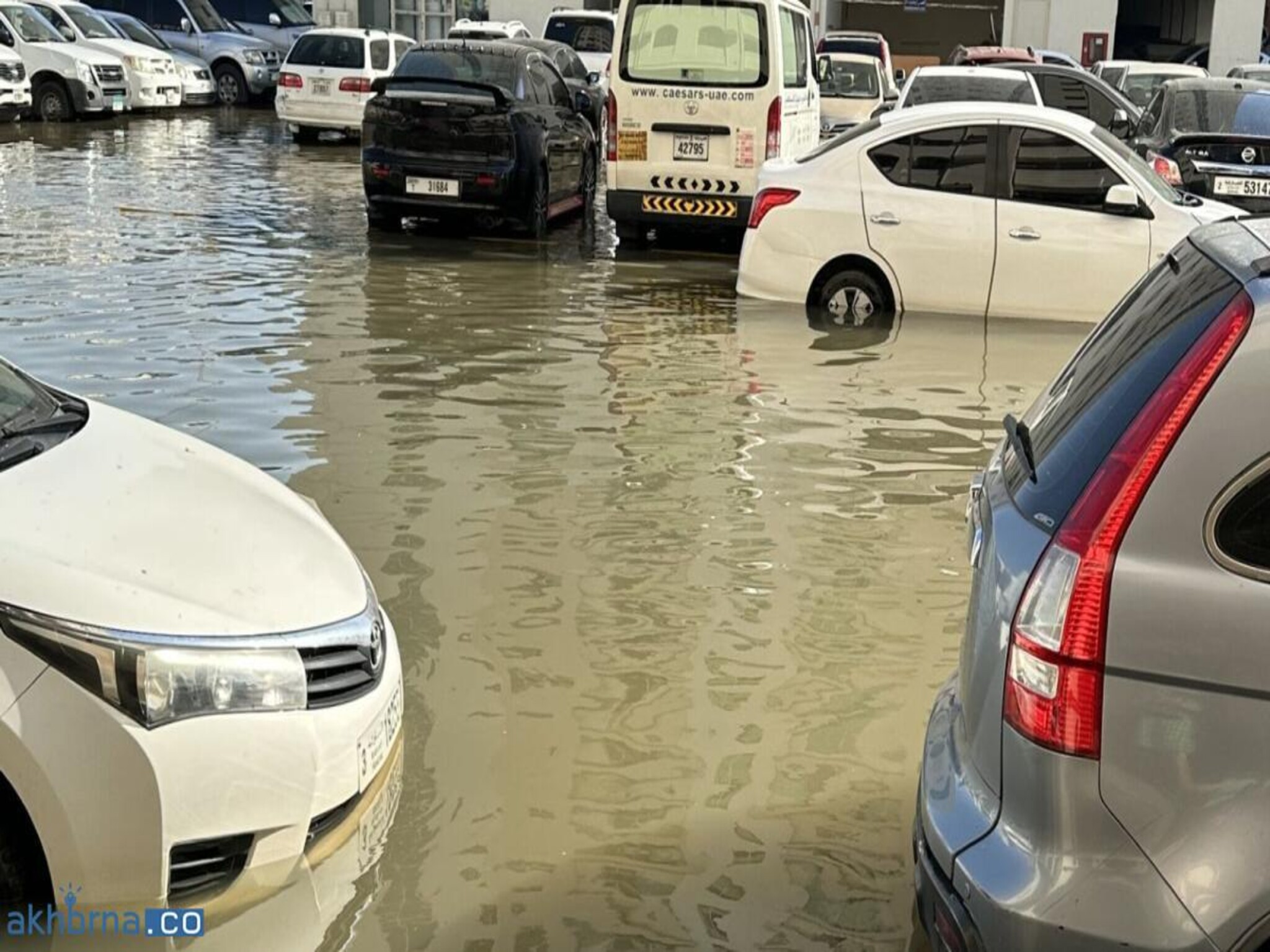 UAE: Work-from-Home Extended as Vehicles Remain Submerged in Flooded Parking Lot