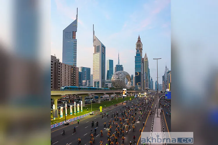 Cyclists ride past the Museum of the Future in Dubai.